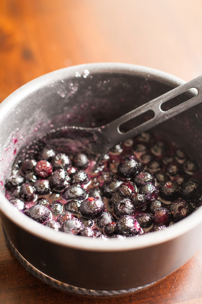 Simmering blueberries for blueberry ice cream.