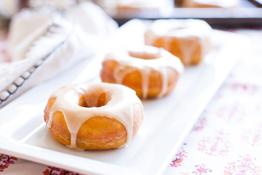 Pumpkin donuts with maple glaze are the perfect donuts for Fall. Real pumpkin and maple syrup makes this the best donut recipe around!