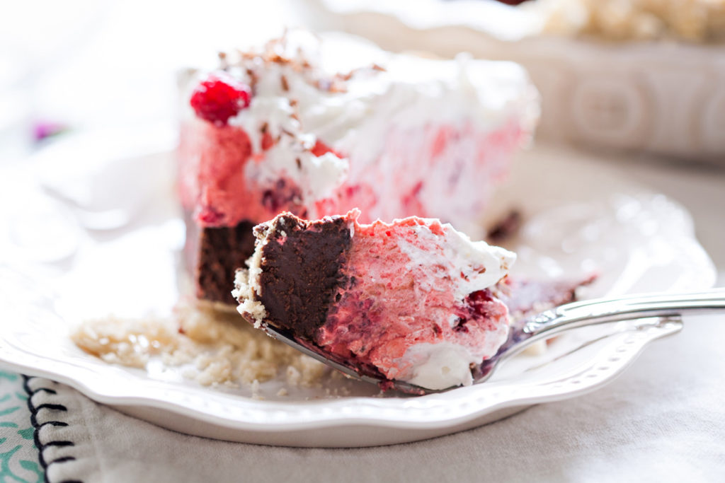 A layer of thick, dark chocolate covered with light raspberry cream. Top with whipped cream and fresh raspberries, and you have a show-stopping dessert! Raspberry Pie, Dark Chocolate Raspberry Pie, Raspberry Cream Pie, Valentine's Pies, Valentines' Day Pies