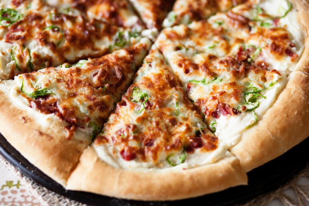 This Jalapeno Popper Pizza is the perfect pizza for dinner or an appetizer! Topped with jalapenos, bacon, onions and cheese, it's amazing! Perfect pizza dough, jalapeno pizza, pizza recipe