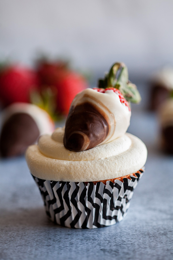 These Strawberries and Cream Cupcakes are full of vibrant strawberry flavor and topped with light and fluffy vanilla cream! The perfect treat for spring!