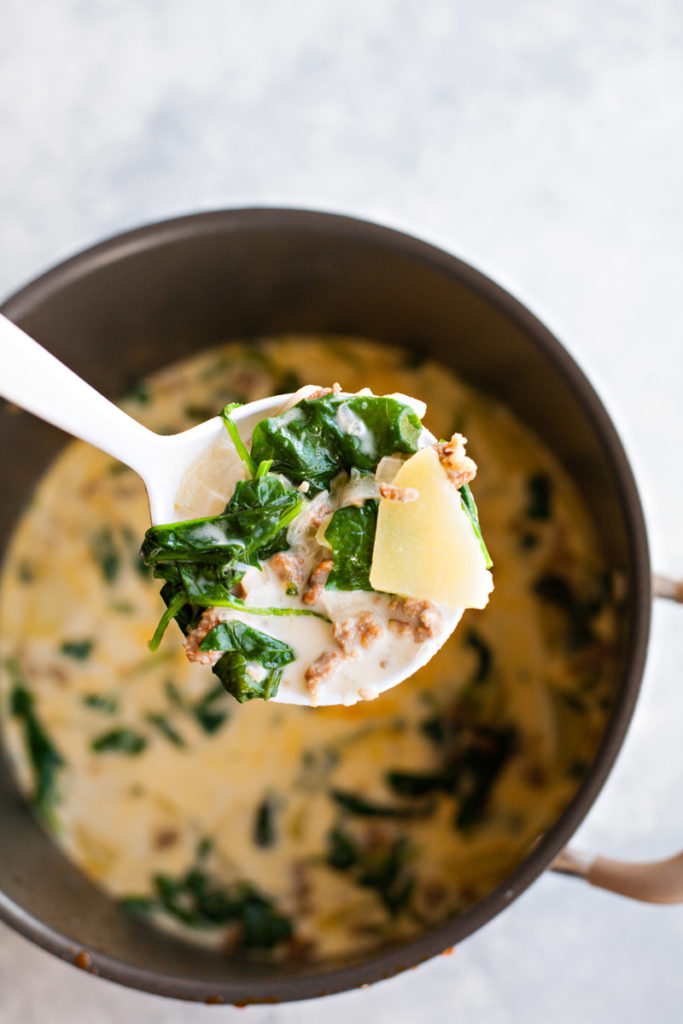 Ladle of Zuppa Toscana Soup.