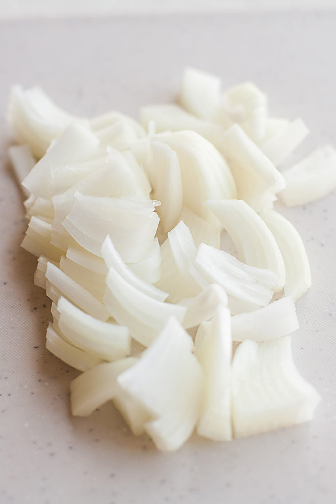 Sliced pieces of white onion.