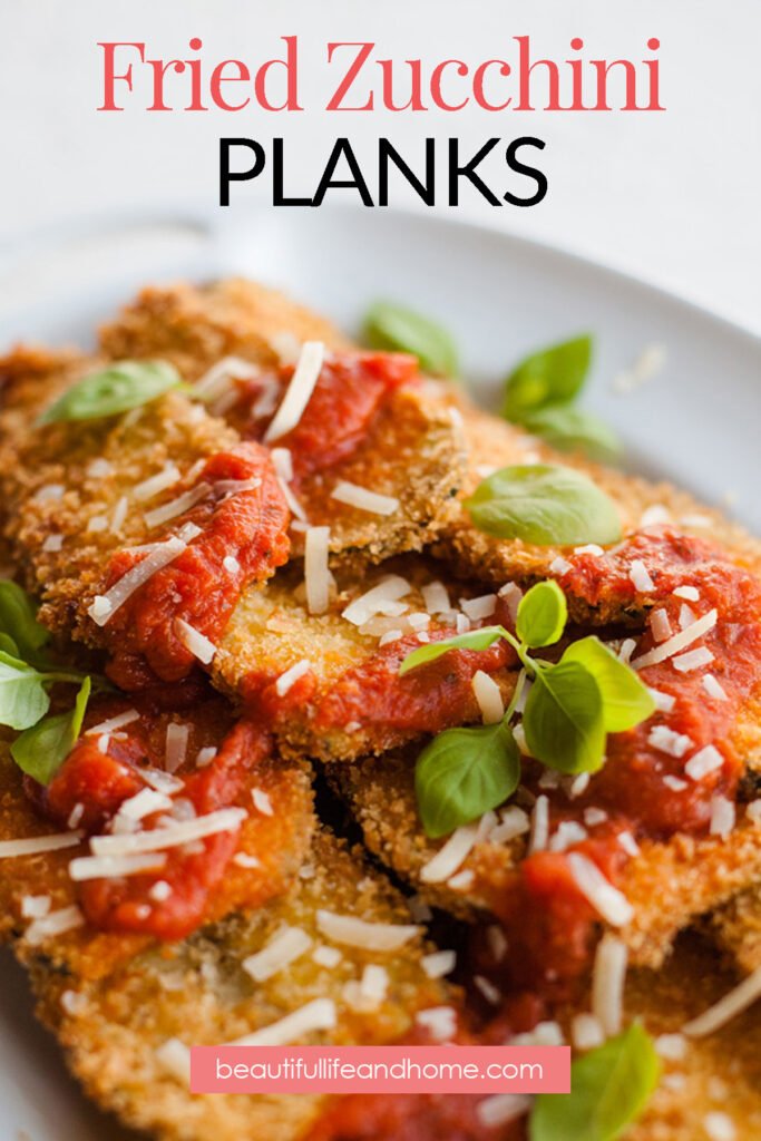 Fried Zucchini Planks made with crispy panko and topped with marinara sauce.