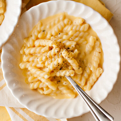 Macaroni and cheese in a bowl with a spoon